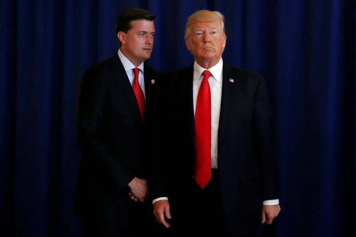 Then-White House staff secretary Rob Porter is seen with President Donald Trump in August.