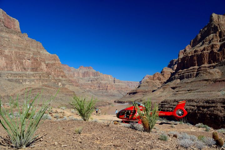 The distinctive red Papillon tour helicopters make dozens of trips to the Canyon each day