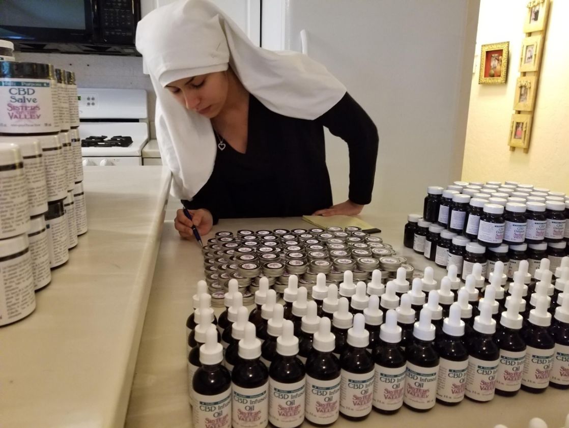 A sister prepares oils infused with CBD (cannabidiol), the non-pyschoactive component of marijuana. 