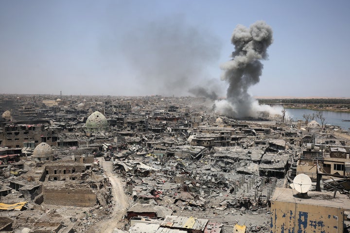 Smoke billows after an airstrike by U.S.-led international coalition forces targeting the so-called Islamic State in Mosul, Iraq, on July 9, 2017.