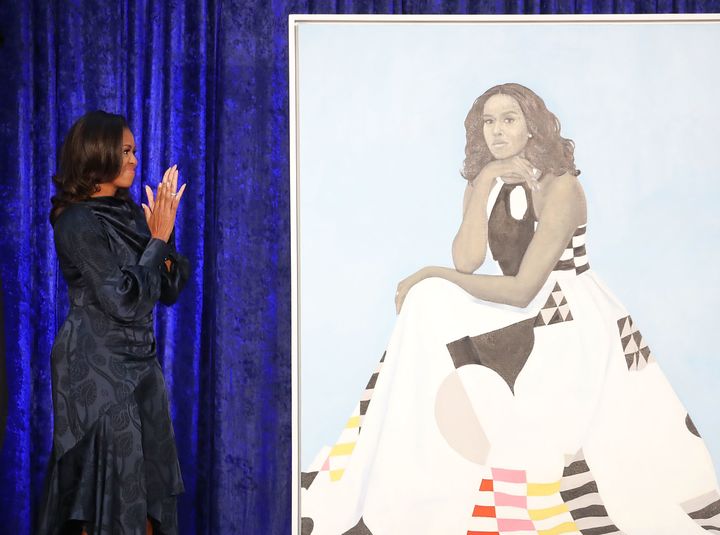 A detail of artist Amy Sherald's portrait of Michelle Obama.