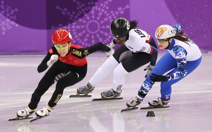 Maame Biney (center) couldn't advance in her 500 meter short-track quarterfinal.