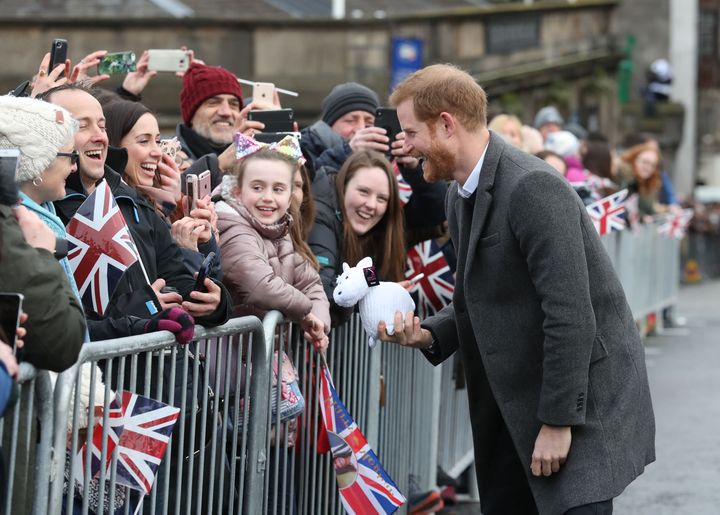 Prince Harry greets crowds during a walkabout on the esplanade at Edinburgh Castle