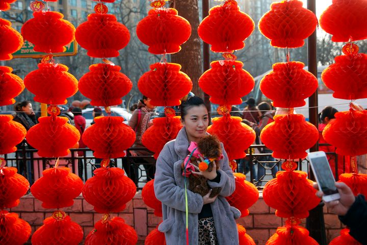 A woman being photographed at Beijing's Longtan Park at the start of Chinese New Year in 2016