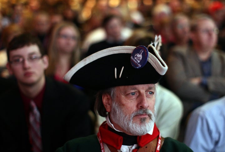 A tea party activist waits for Sen. Marco Rubio to deliver a speech during the annual Conservative Political Action Conference in 2012.