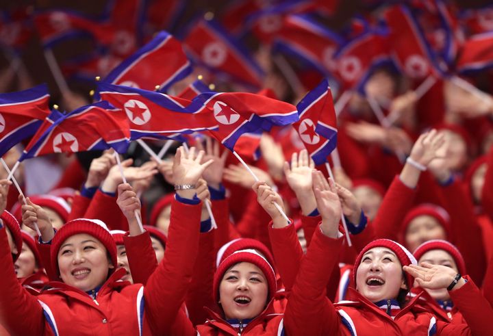 North Korean cheerleaders wave flags during the Pair Skating Short Program on day five of the Pyeongchang 2018 Winter Olympics.