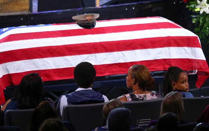 Family members at the Oct. 20 funeral of Las Vegas police officer Charleston Hartfield, who was among the 58 people killed by a gunman Oct. 1. 