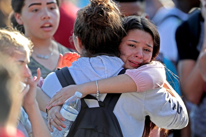 Students embrace after being released from a lockdown during Wednesday's shooting.