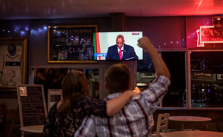 A customer reacts while watching a telecast in a bar in Randburg, Johannesburg, as South African President Jacob Zuma announced his resignation Wednesday.