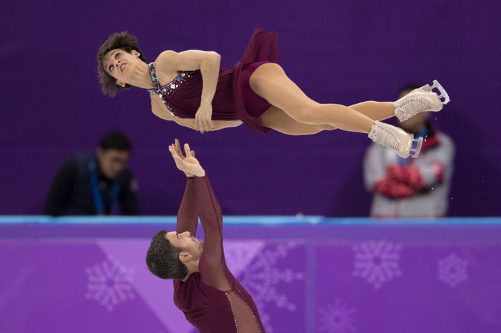 Eric Radford and Meagan Duhamel compete in the pair skating free skating.