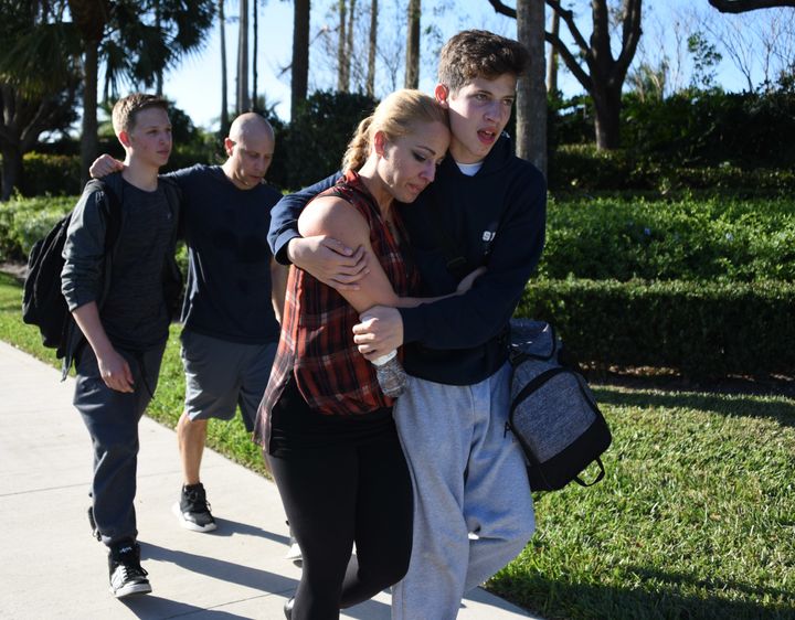 Students at Marjory Stoneman Douglas High School leave the scene of the shooting.
