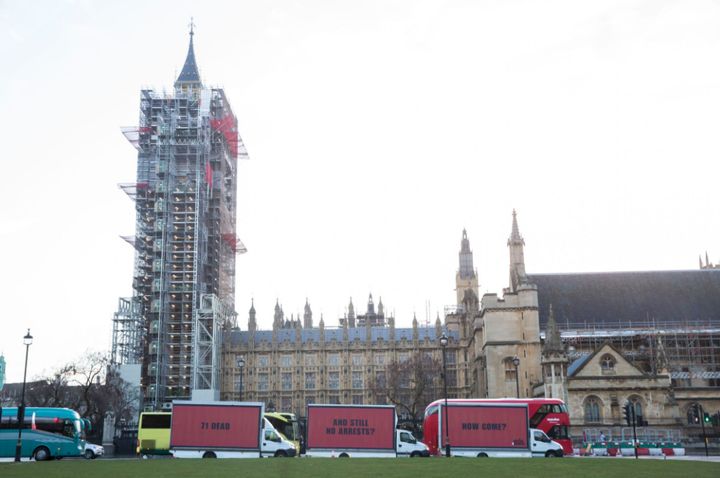 The billboards were paraded through central London before arriving at the scene of the fire in North Kensington 