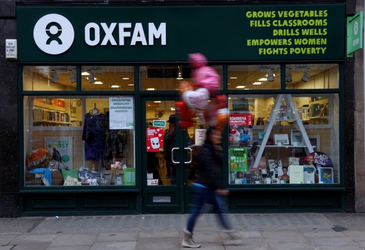 A pedestrian walks past a branch of Oxfam in London 