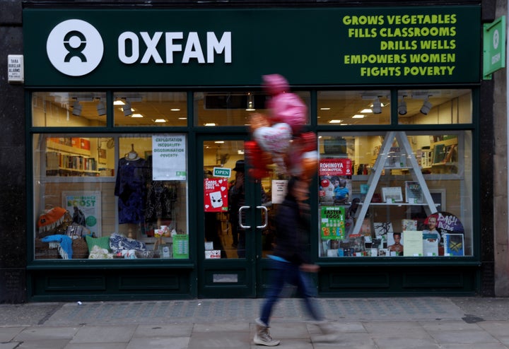 A pedestrian walks past a branch of Oxfam in London 