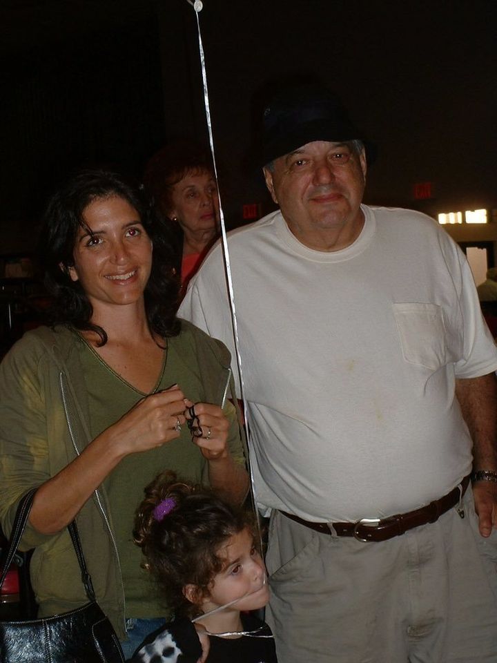 A family photograph of Merri Novell with her daughter Carly and father Charles Cohen.