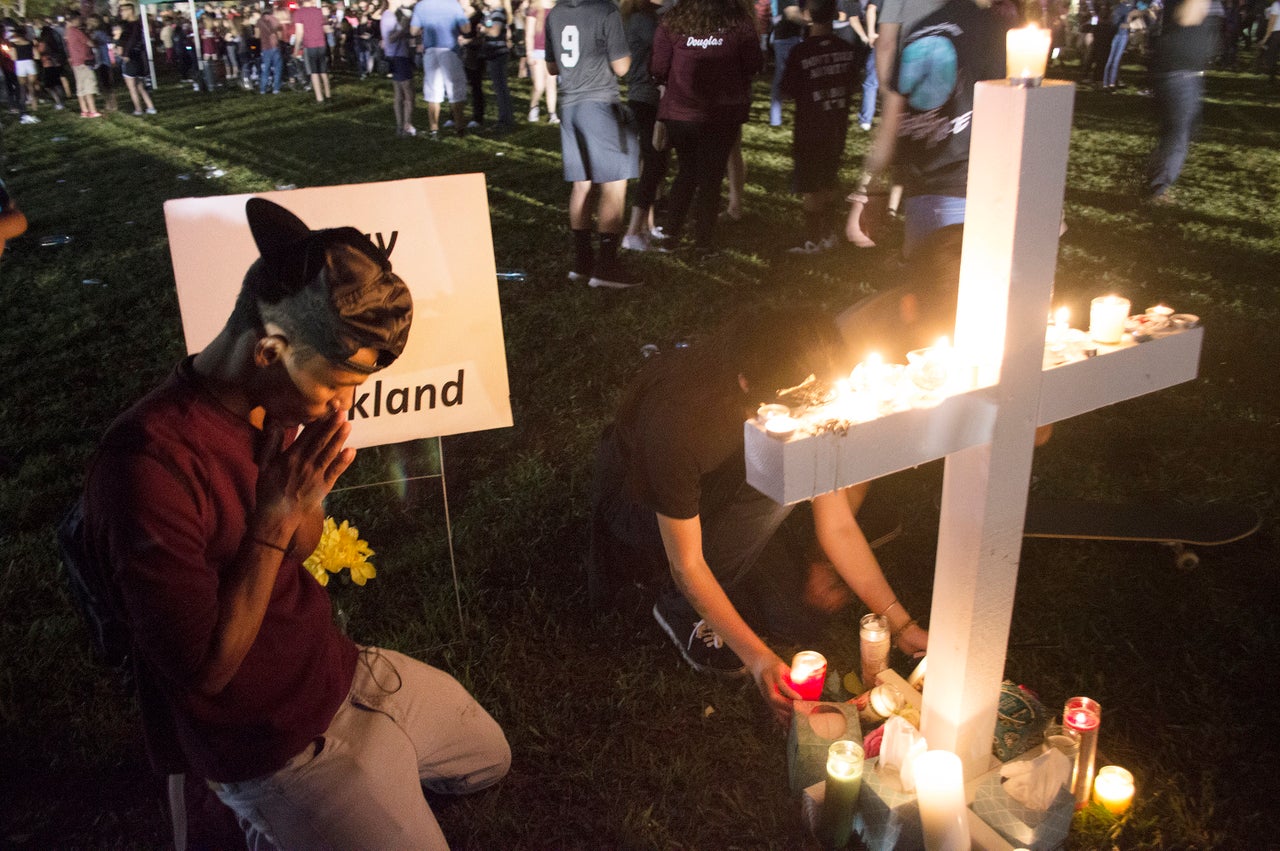 Jay Eaton, 19, prays for the lives lost in this week’s school shooting. He said he’s thankful his cousins, who attend Stoneman Douglas High, weren’t killed.