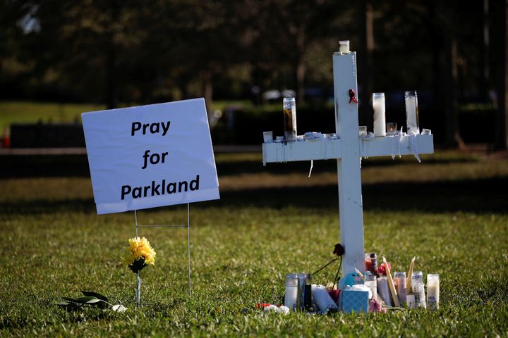 A cross commemorating the victims of the shooting at Marjory Stoneman Douglas High School sits in a park in Parkland, Florida, on Feb. 16, 2018.
