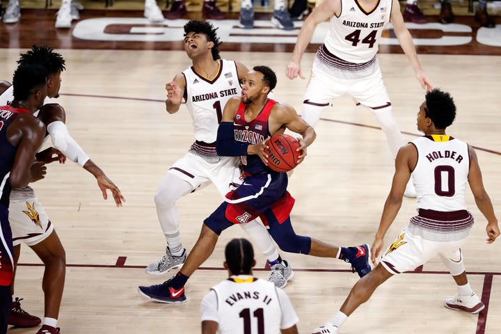 A cheerleader was tossed for razzing Arizona State's Remy Martin (No. 1, pictured on defense) as he shot a free throw in the game against Arizona State.