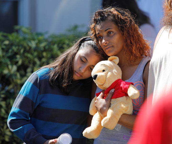 Mourners attend a community prayer vigil for victims of the shooting at Marjory Stoneman Douglas High School in Parkland, Florida, on Feb. 15, 2018.