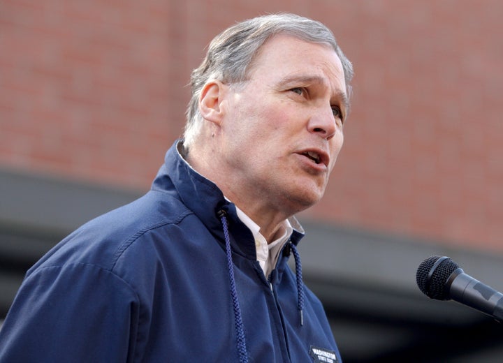 Washington Gov. Jay Inslee (D) speaks to reporters. State-level single-payer health care is likely to be on the ballot in Washington state this year.