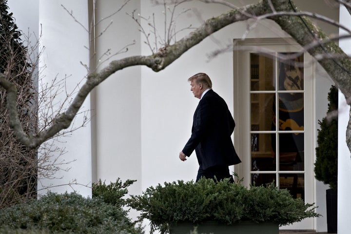 President Donald Trump walks out of the Oval Office on Feb. 16. 