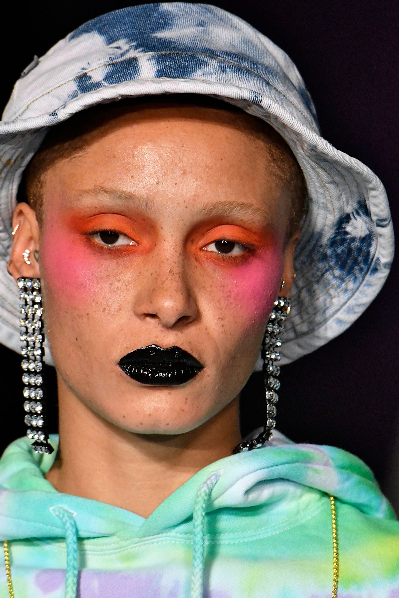Adwoa Aboah looked stunning in this bright pink blush for Ashley Williams AW18 catwalk, proving the shade is flattering on a variety of skin tones.