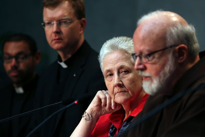 Marie Collins (second from right) watches as Cardinal Sean Patrick O'Malley (right) speaks during a briefing of the Pontifical Commission for the Protection of Minors on May 3, 2014. 