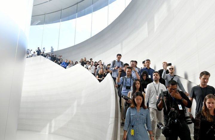 Members of the media enter the Steve Jobs Theater at Apple's new headquarters ahead of new product announcements in Cupertino, California, on Sept. 12, 2017.