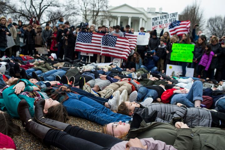 Demonstrators on the ground during a lie-in demonstration supporting gun control reform on Monday.