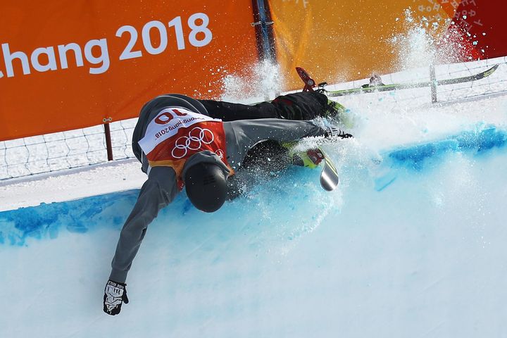 Joel Gisler of Switzerland hit the top of the wall during the halfpipe event at the Winter Olympics.
