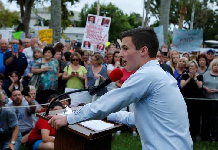 Cameron Kasky, a student at Marjory Stoneman Douglas High School, speaks to protesters at a Call To Action Against Gun Violence rally by the Interfaith Justice League and others in Delray Beach, Florida on Feb. 19, 2018.