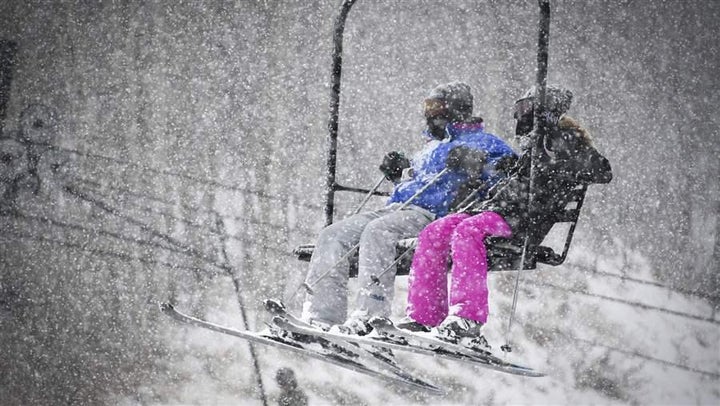 Skiers ride the chairlift at Sunlight Mountain Resort in Glenwood Springs, Colorado. Water scarcity and new research are spur