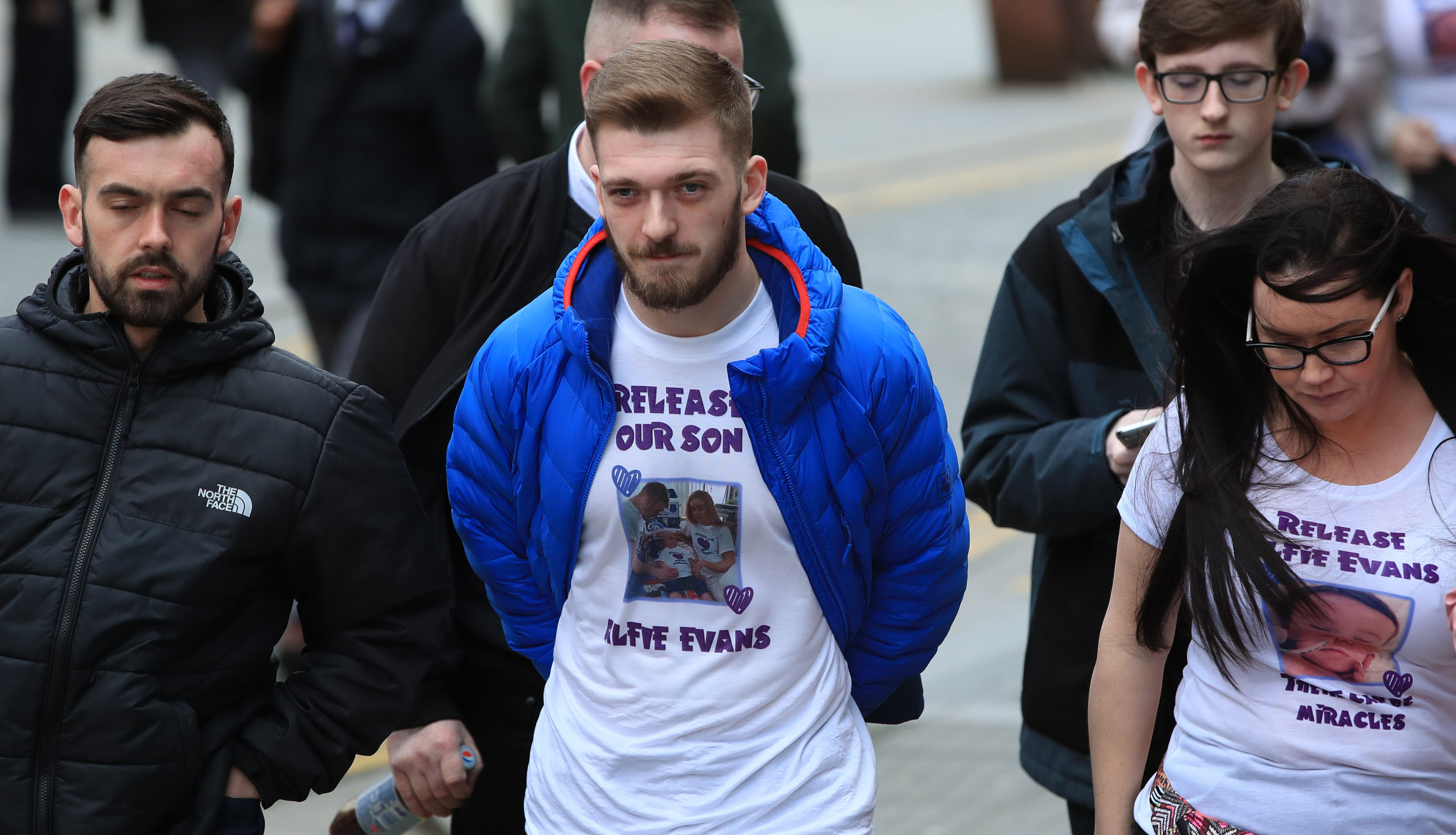 <strong>Tom Evans (centre) the partner of Kate James, the parents of 20-month-old son Alfie Evans, outside Liverpool Civil and Family Court during a hearing related to their dispute with medics looking after their son Alfie at Alder Hey Children's Hospital.</strong>