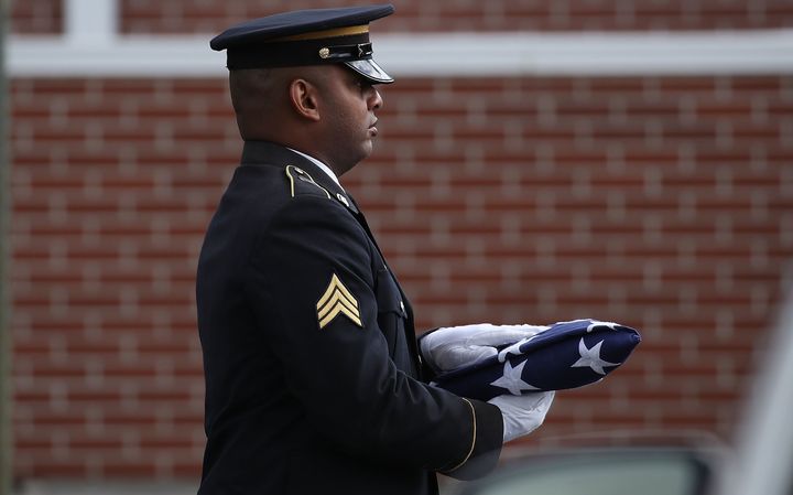 An American flag is carried into the funeral for Alaina Petty on February 19, 2018 in Coral Springs, Florida.
