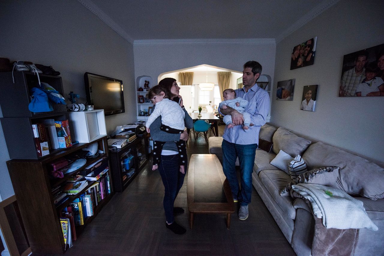 Jennie and Gary Landsman hold Benny and Josh in the living room of their Brooklyn, New York, home. When both parents are carriers for Canavan disease, there's a 25 percent chance that a child will inherit it.