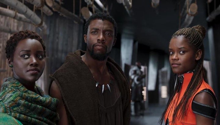 Left to right: Nakia (Lupita Nyong'o), King T'Challa (Chadwick Boseman) and Princess Shuri (Letitia Wright) stand side by side in "Black Panther."