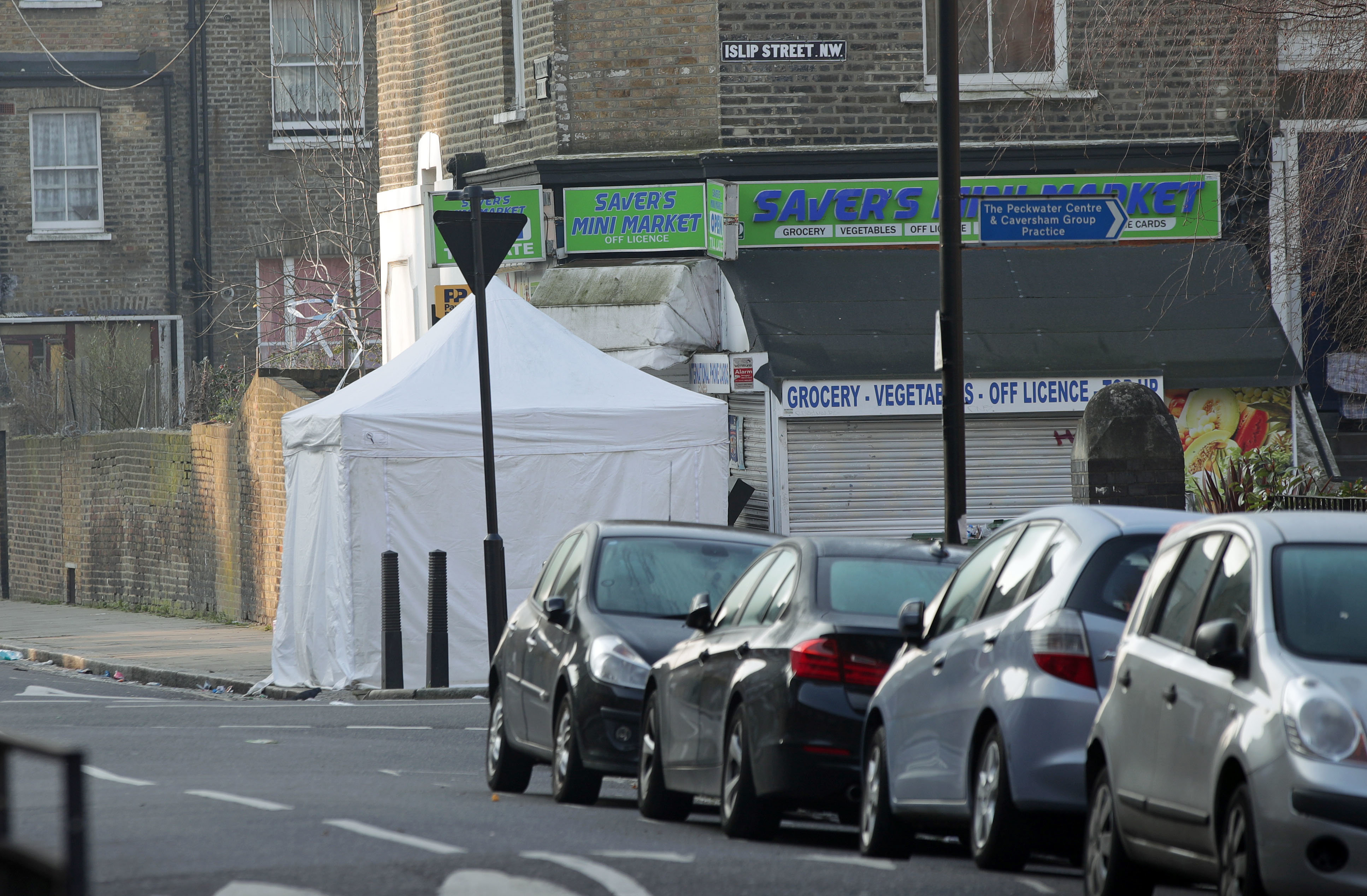 <strong>A police forensics tent on Bartholomew Road in Camden London after a young man was fatally stabbed</strong>