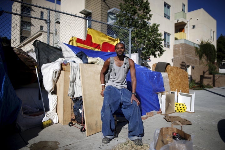 Dontray Williams by the tent he lives in on the streets of Los Angeles. He has been periodically homeless for five years and is hoping to find a job and an apartment.