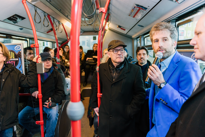 Tübingen Mayor Boris Palmer speaking on one of the city's buses. The city is trying out a program where public transit is free for passengers on Saturdays.