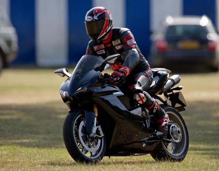 Prince William leaves the Coworth Polo Club on his Ducati motorbike after playing in the Westbury Shield charity polo match on July 5, 2009 in Ascot, England. 