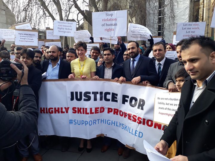 <strong>Alison Thewliss with the skilled migrants protest outside Parliament</strong>