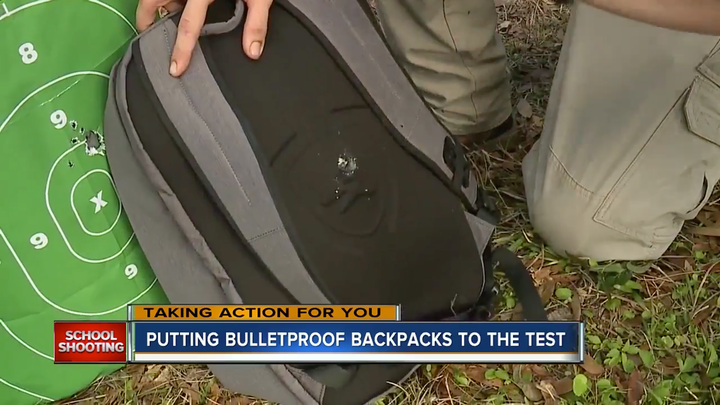 Bullet holes from an AR-15 rifle appear in the back of Guard Dog Security's bulletproof backpack.
