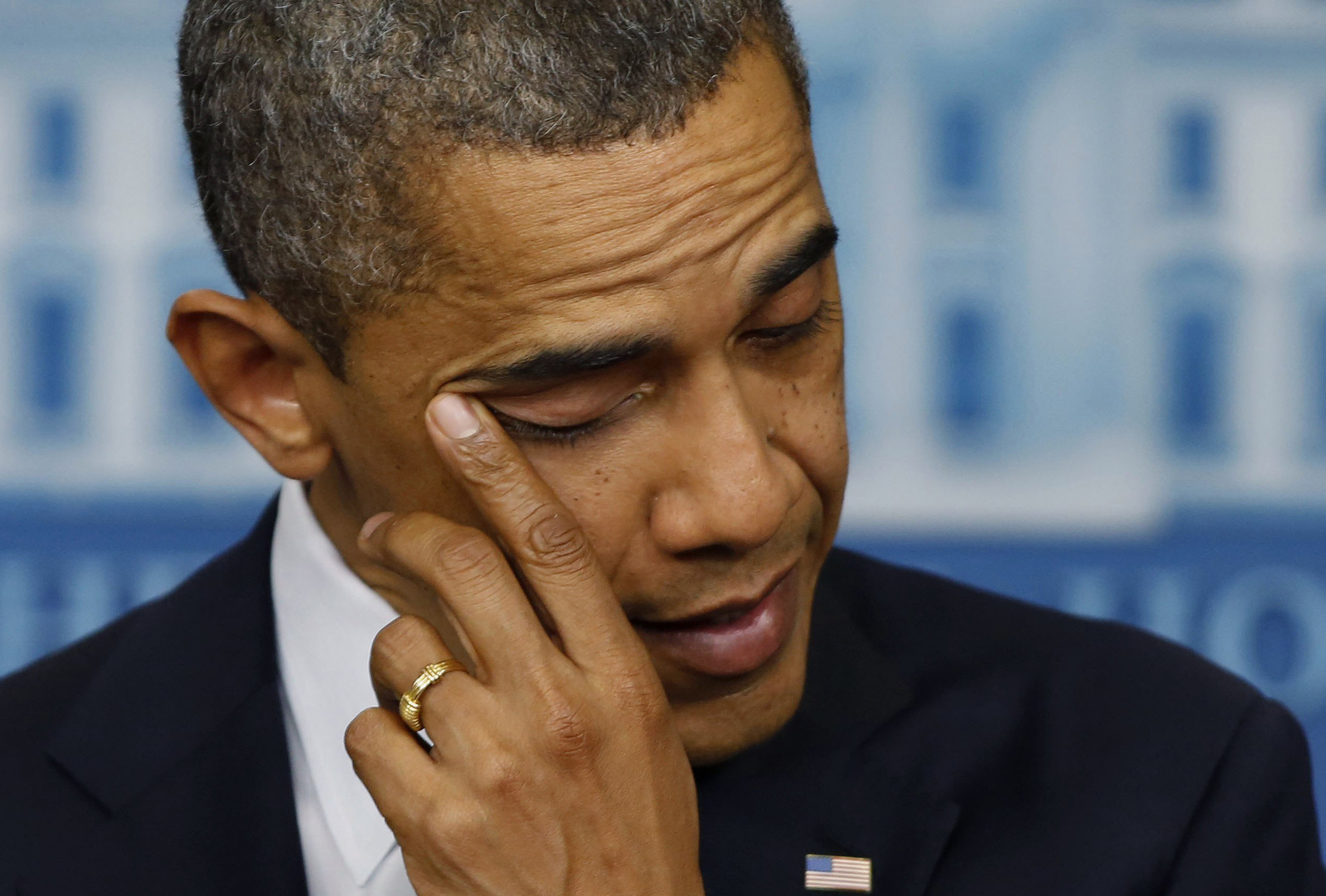 <strong>President Obama wipes tears from his eyes during a press conference on the Sandy Hook shooting</strong>