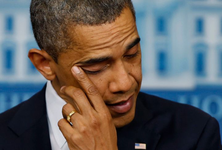 President Obama wipes tears from his eyes during a press conference on the Sandy Hook shooting