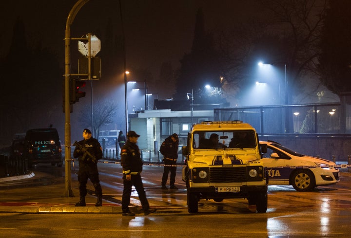 Police guard the entrance to the United States embassy building in Podgorica, Montenegro on Thursday after an attack.