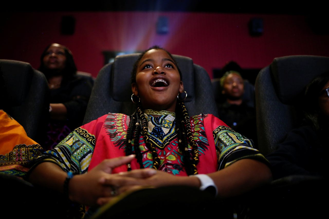 Ron Clark Academy sixth-grader De Ja Little, 12, joins classmates in watching the film "Black Panther" on Feb. 21, 2018.