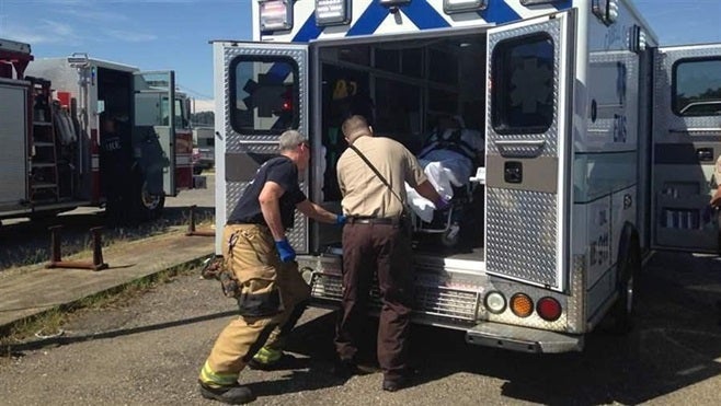A woman is loaded into an ambulance in Huntington, West Virginia, following an opioid overdose rescue. Experts say a decline