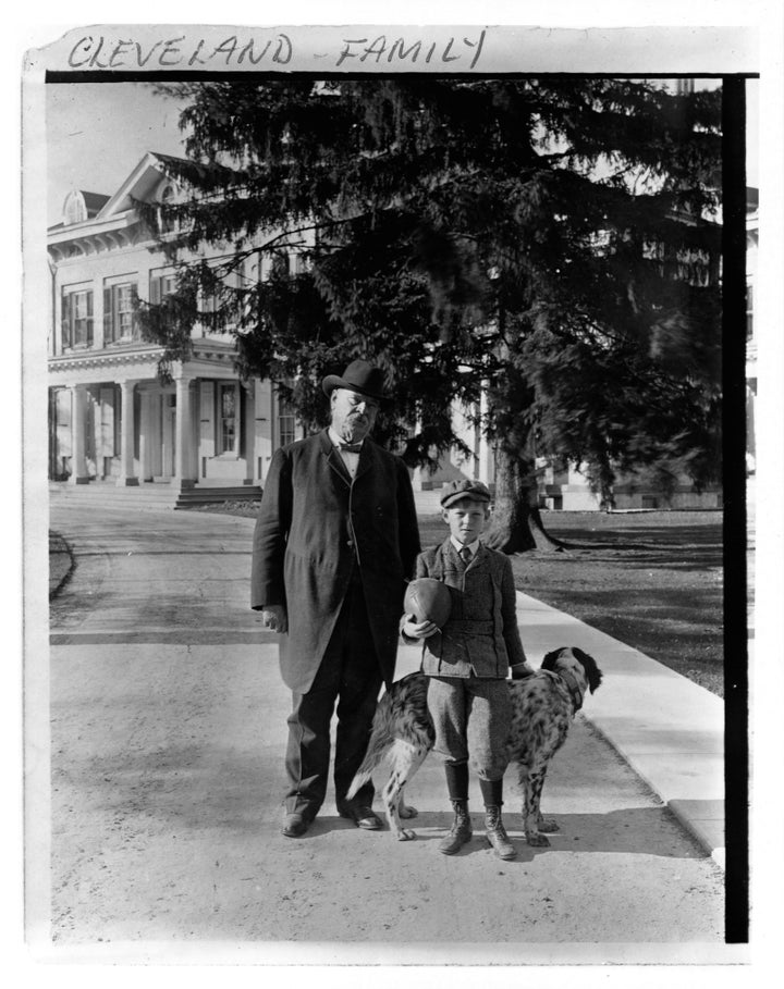 Cleveland with his son, Francis, and dog. 