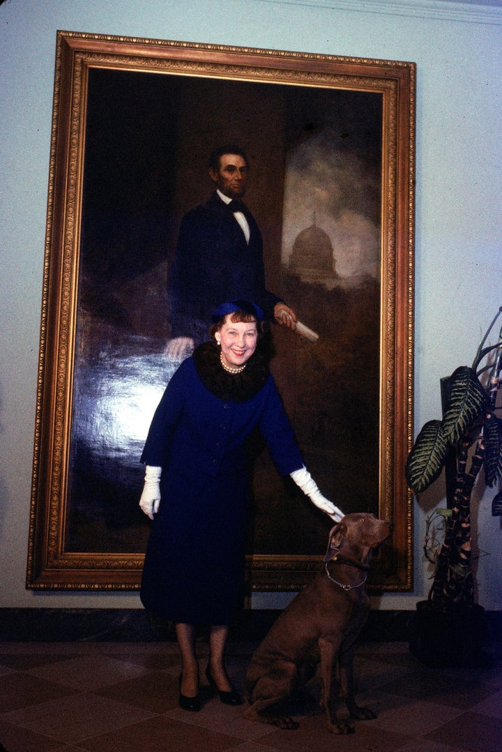 First Lady Mamie Eisenhower poses with pet Weimaraner Heidi, who had just been awarded a lifetime membership to the Tailwaggers Club in 1958.