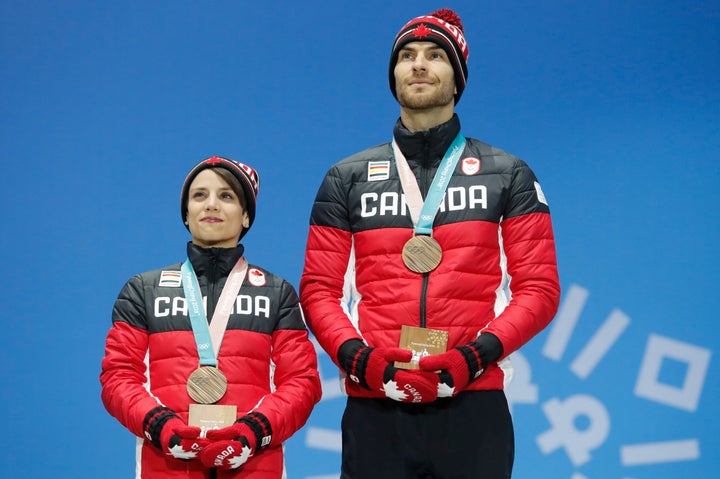 Canada's Eric Radford, right, became the first openly gay man to win a gold medal at a Winter Olympics this month.